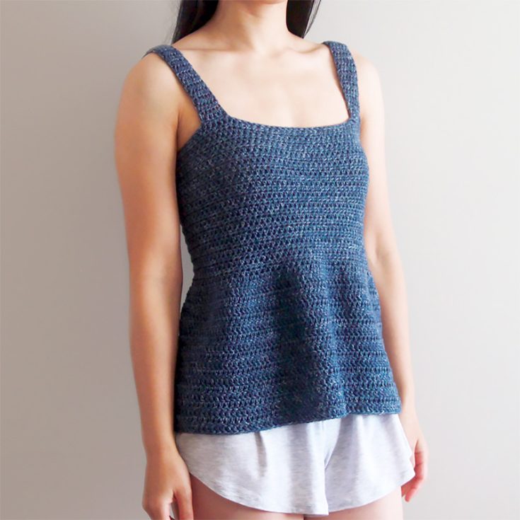 The crochet peplum tank top pattern features&nbsp;a square neckline and a flared hem, which gives the silhouette some structure. The size chart goes as follows: XS (S, M, L, XL, 2XL, 3XL).