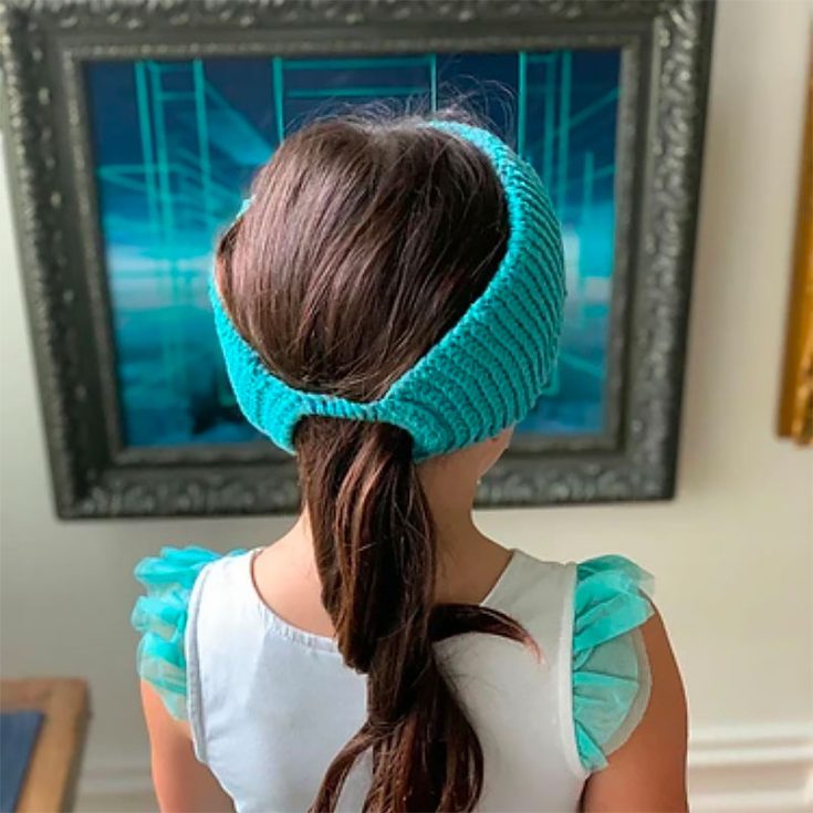 If you always feel as if your ponytail gets in the way, this crochet ear warmer headband has a hole designated for you to put your low ponytail through it.