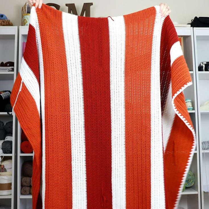 Don't be afraid to try large crochet projects; this blanket is made up of entirely double-crochet stitches! You can customize the size by increasing or reducing the number of starting chains. If you're not comfortable changing yarn colors, you can create this blanket in a single yarn color.