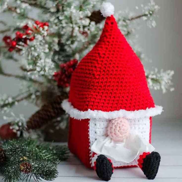 This gnome tissue cover box may look complex with all the boxy edges and protruding arms and legs. But in reality, it's actually pretty simple. The cover portion is worked as one piece, and then the hat, legs, and nose are crocheted separately and sewn to the cover at the end.