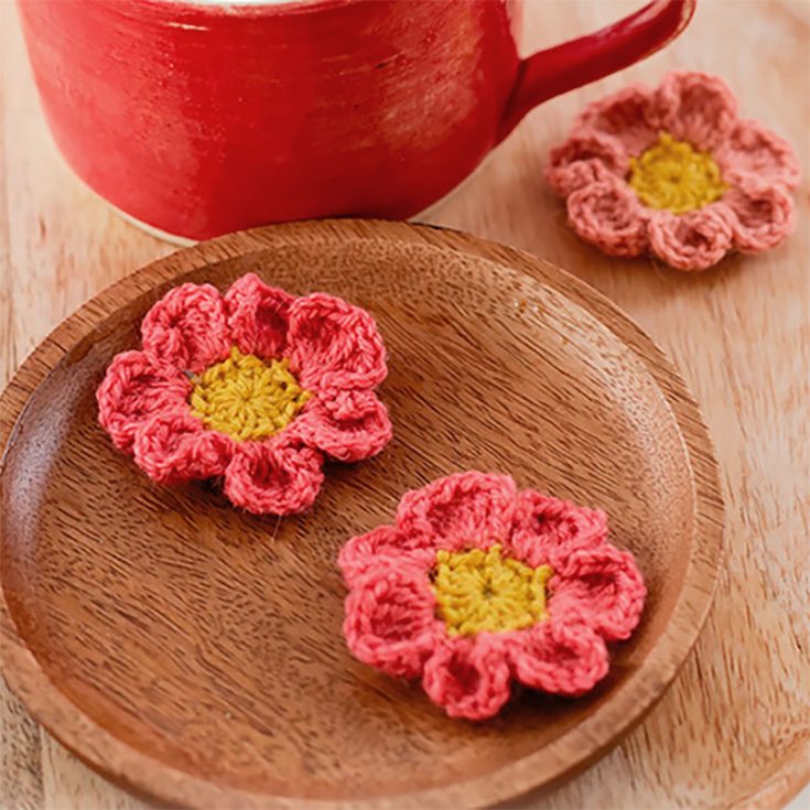 Spring daisies are wildflowers that thrive in harsh environments. Crochet this pattern as a reminder to persevere in difficult times for yourself or for those around you who need it. From the center out, the piece is worked in the round.