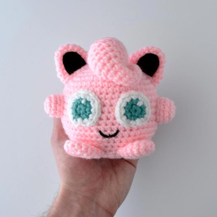 Here's Jigglypuff in a smaller size. She has a round pink body, pointed ears, and big blue eyes, all of which contribute to her adorable appearance.