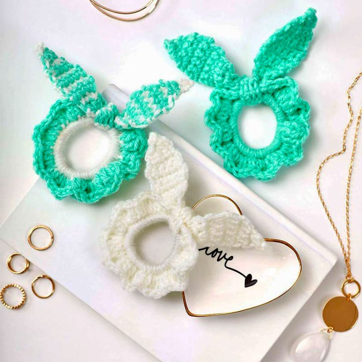 Add bunny ears to your crochet scrunchies for a cuter look. Design and crochet a bunch of these for the holidays and spread the holiday cheer.