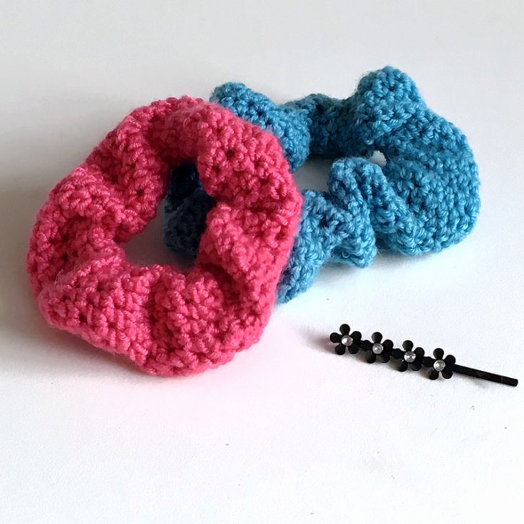 Here's another easy crochet hair scrunchie tutorial that uses single crochets and half double crochets in a spiral. There is also a video tutorial for visual learners.