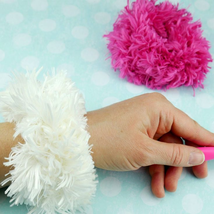 Work with Jumbo Fur Yarn to create this faux fur effect crochet scrunchie. It's fun, it's loud, it's the statement piece you need.