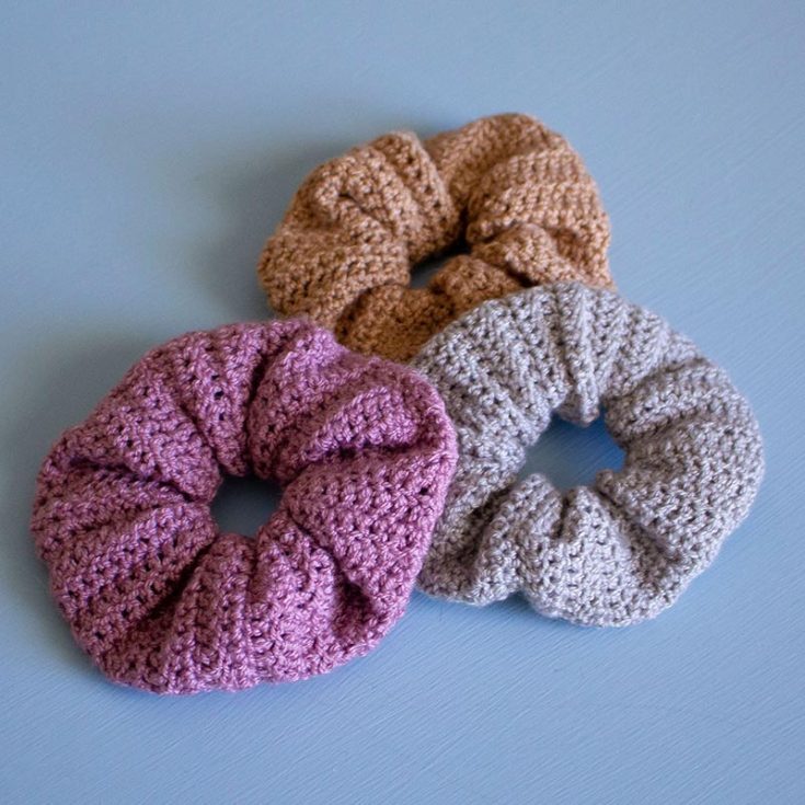 Starting with a rectangle of fabric crocheted with double crochet stitches, it is joined and stitched up to make a crochet scrunchie. For the beginner: A foundation chain and a row single crochet can be used in place of the FSC (Foundation Single Crochet). Replace the stacked single crochet (STSC) with two chain stitches.