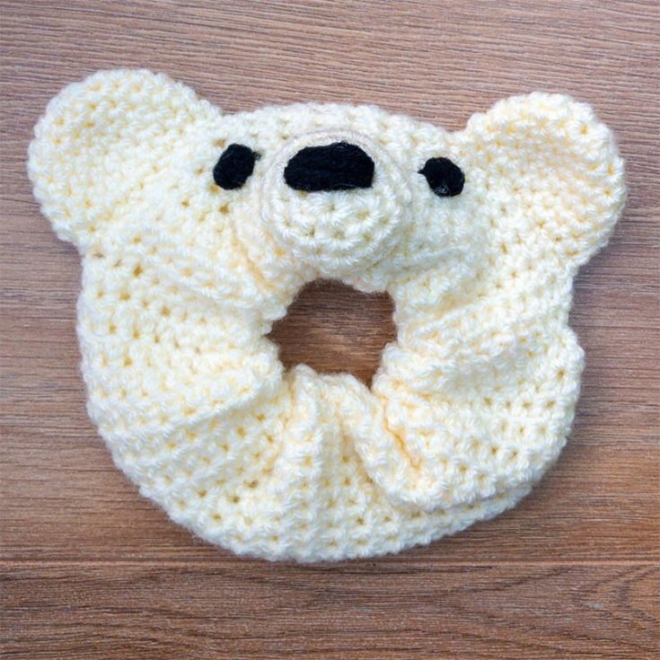 The scrunchy features a lovable teddy bear design, making it a delightful addition to hairstyles for all ages. Explore your creative side and add a touch of personality to your daily wear with the Teddy Bear Scrunchy pattern.
