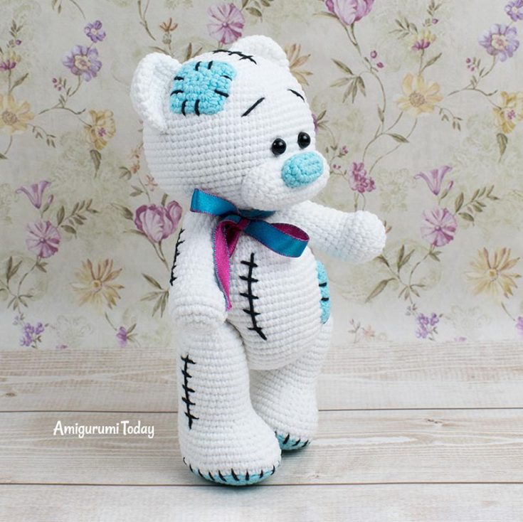 This precious teddy includes so many unique details that truly make it stand out with its own personality. With its little stitches, blue patches, and interesting blue-and-white pairing, you can easily switch them out to fit your own color palette!