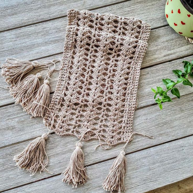 This fun boho pattern features a shell stitch that is very fun to crochet. Add on some tassels to further give the runner some personality.