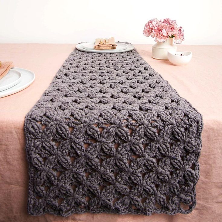 Inspired by macrame, this table runner showcases texture upon texture. It&rsquo;s made with a 4-row repeat using the back post treble crochet.