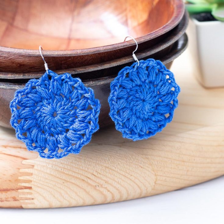 What does one do with decade-old embroidery floss? Crochet some earrings! This uses the first two rounds of a sunburst granny square to create the lovely earrings.