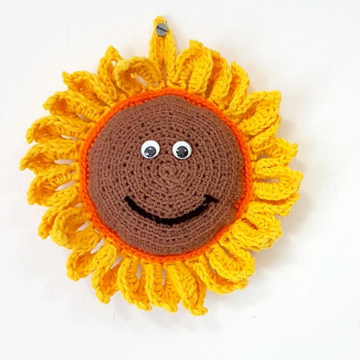 Crochet this sunflower amigurumi to be used as a decorative wall hanging or a toy for the young ones in their nursery! It's fairly simple, made with two circles joined together. If you like, you have the option to customize the colors of the sunflower to create a unique and non-traditional look.