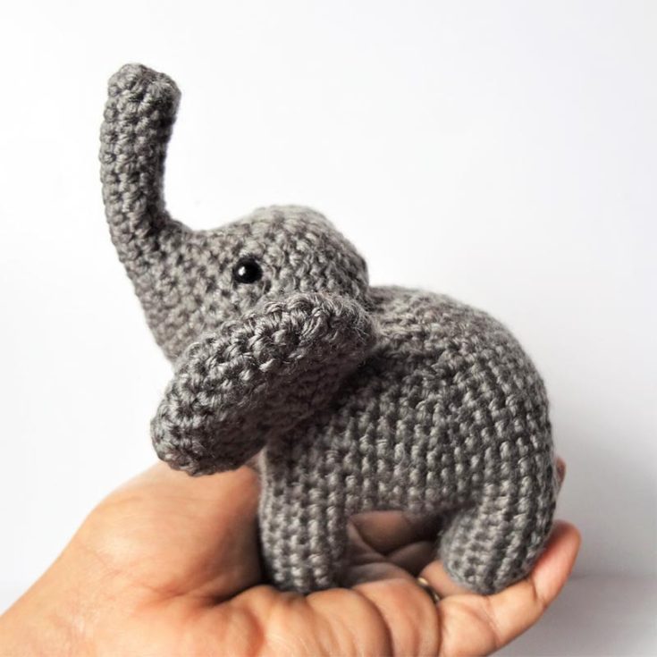 This free crochet elephant pattern features a palm-sized elephant standing on all fours. Because it's small, it works up relatively quicker and uses less yarn. Personalize it by adding a bow, flowers, and other accessories to your little elephant.
