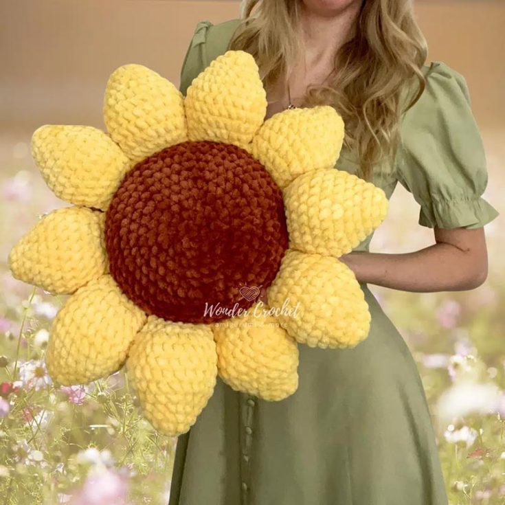 This No-Sew Flower Pillow pattern features vibrant colors and intricate design on a huggable pillow! It is a great addition to your living room or bedroom or even a huggable pillow for long car rides.
