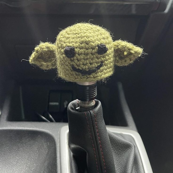 Need some wise words during a long boring ride alone? Cover up your gear stick with this Baby Yoda knob cover pattern to get inspired.