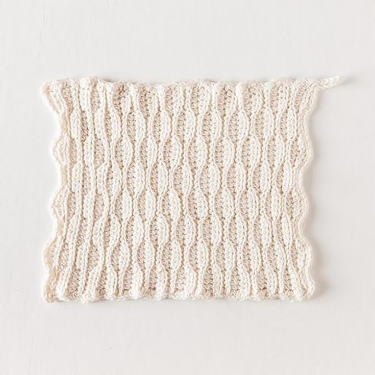 This intermediate-level dishcloth uses a textured honeycomb-inspired stitch to create a pretty dishcloth for the kitchen. The finished size measures 8.5" x 9".