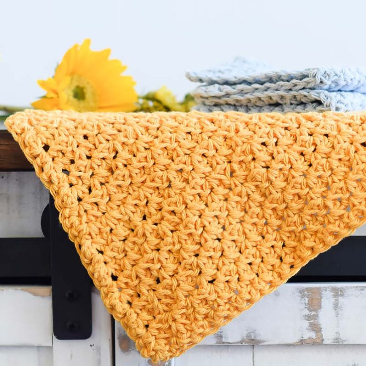 These durable farmhouse-style washcloths are perfect for cleaning and scrubbing in the kitchen. They measure approximately 9"x 9" and use the spider stitch, which includes the single crochet chain stitch.