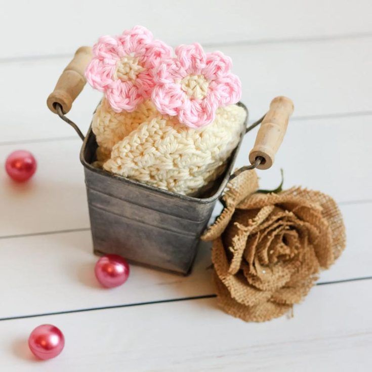 This washcloth is not only beautiful but also easy to make. It is made using a gently textured Suzette Stitch and has a lovely Cherry Blossom Flower added later. The washcloth measures 7 1/2&Prime; x 8&Prime;, but it can be resized to your preference. You have the option to personalize the washcloth by adding your favorite flower at the end.