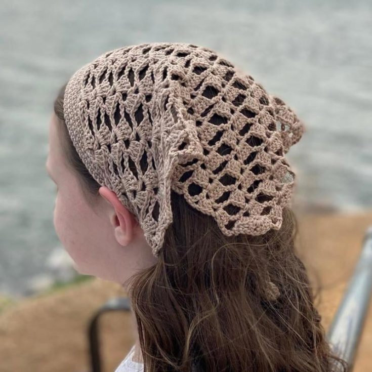 Summer is for road trips and walks along the beach. What better way to keep your hair out of your face than with this crochet hair kerchief! The finished product measures about 32 inches wide x 13 inches deep and can fit older children, teens, and most adults. This is an intermediate-level project.