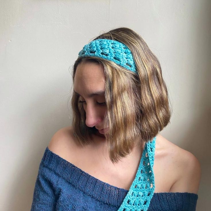 This crochet headband bandana can be achieved using single crochets and puff stitches. It creates an airy pattern that still does its job of holding all those loose strands back. After blocking, this finished piece measured 2&rdquo; / 5 cm x 44&rdquo; /110 cm.