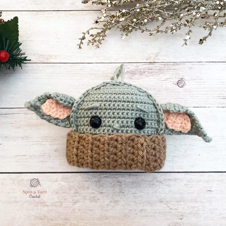 This easy-to-follow, ragdoll-inspired Baby Yoda ornament is an ideal project for beginners. It makes for a delightful crochet activity to unwind in the evening. The finished ornament is approximately 7 inches wide, measuring from the tips of the ears.