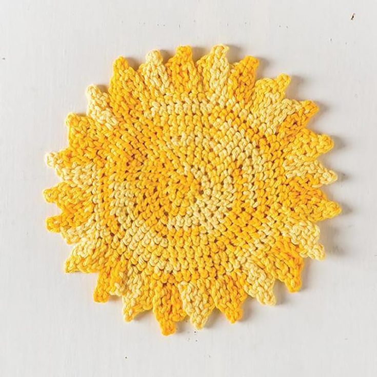 Keep your kitchen joyful by lighting it up with this sunray dishcloth! Such a unique shape for a dishcloth. It's an intermediate pattern that produces a 7.5" diameter cloth.