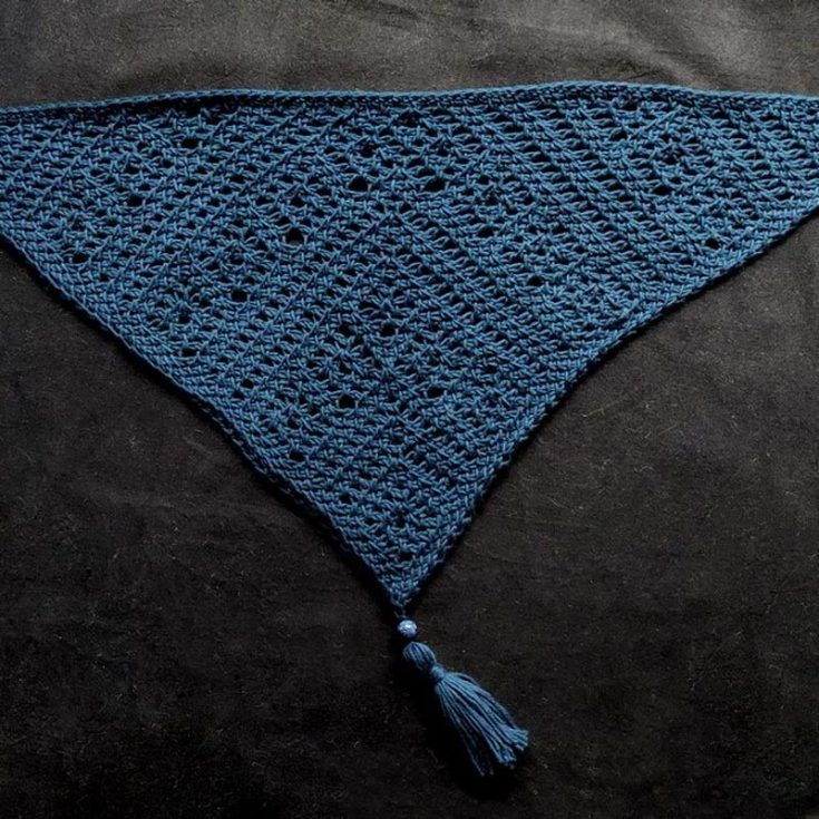 This bandana crochet pattern is constructed from the tip at the bottom, and it grows with each row. It's an advanced pattern because the intricate lace makes it challenging, but that also means more fun and a whole lot more satisfaction!