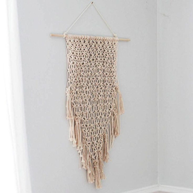This beginner-friendly macrame wall hanging is effortless to make. Using only cotton cords and a single-knot pattern with tassels at the bottom, you&rsquo;ll macrame your own rendition of this design in a jiffy!