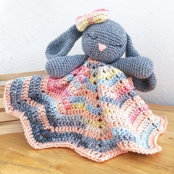 This written pattern attaches a cute bunny figure to a blanket or hand towel. It will guide you through the easy process of crocheting and attaching the piece of a bunny to a blanket. The bunny head is 12", the ears 5.5", and the arms are 4.25" long.