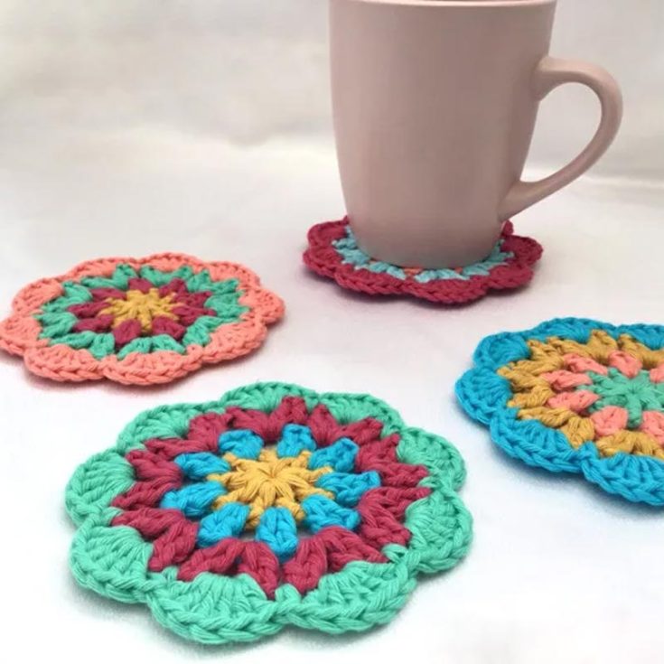 Great as a stash buster, use all the vibrant, colorful, leftover yarn scraps by matching them together to create these lovely yet practical mandala crochet coasters.