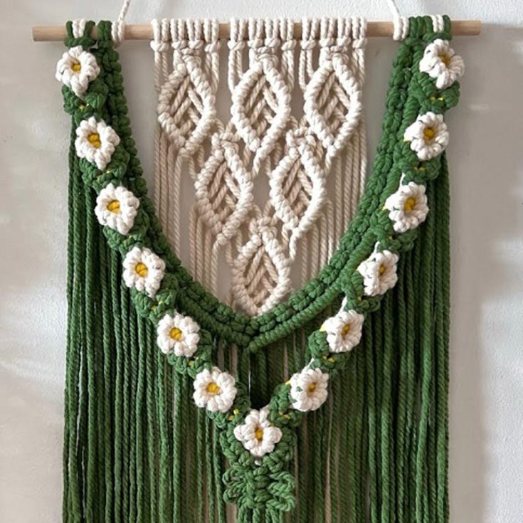 Try out this gorgeous green daisy macrame wall hanging! It&rsquo;s so cute and adds the perfect greenery touch to any space. Join the fun of macrame with this easy pattern and video tutorial to help guide you. You&rsquo;ll be weaving like a pro in no time.