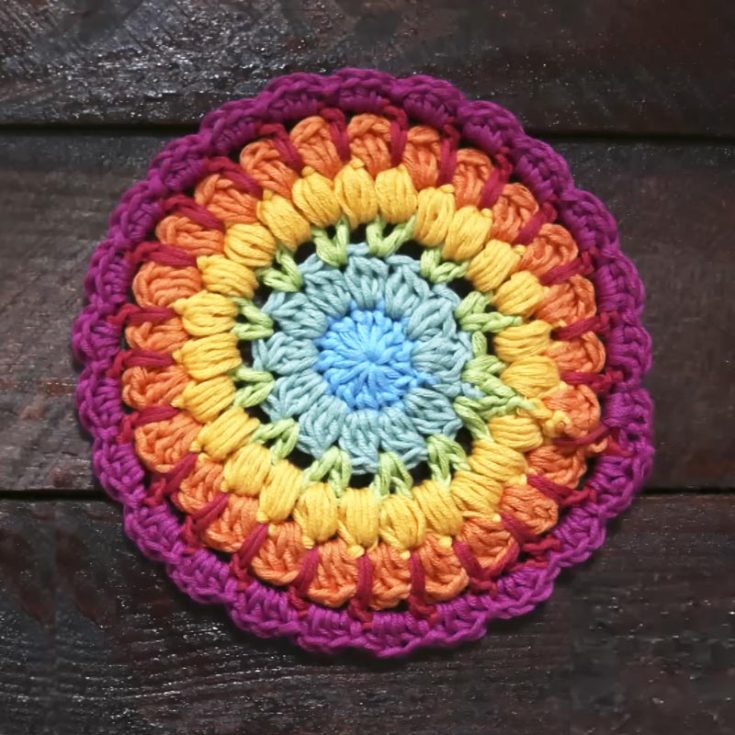 This rainbow sunflower-like mandala crochet would make a great coaster or decoration in the house. It has almost every rainbow color and is genuinely a joy to make. It is in the form of a YouTube video tutorial for all you visual learners.