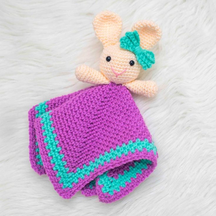 If the previous crochet bunny hand towels or handkerchiefs were not enough, here is another cute version of a bunny on top of towels. Customize the towel to the size you need, and the bunny on top will be an excellent holder! It is 4.5&rdquo; tall (head) and 11.5&rdquo;x11.5&rdquo; (blanket).