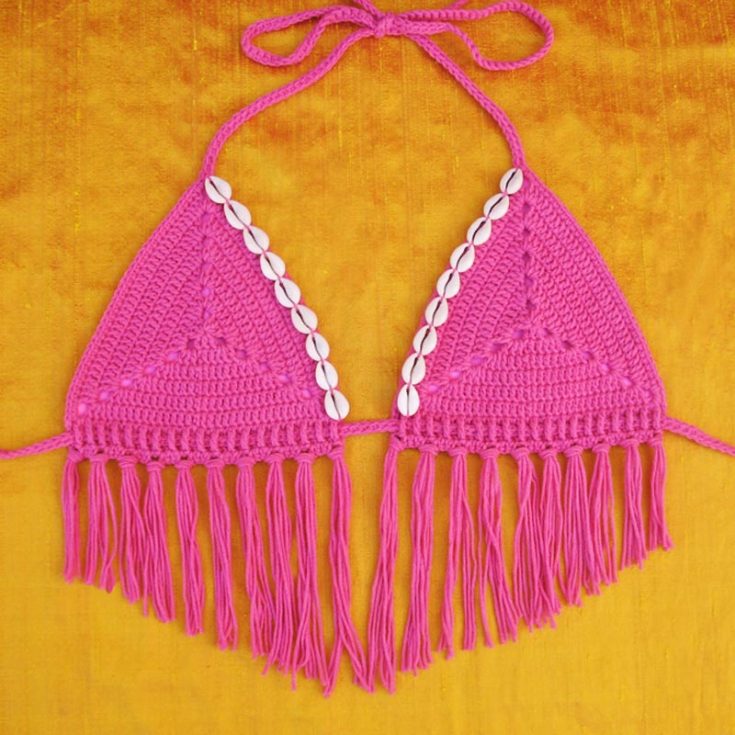 This pattern has two options: a ruffle bottom for a more dramatic flair or a fringe bottom for a delicate look. It comes in sizes XS through XL and is suitable for an advanced beginner.