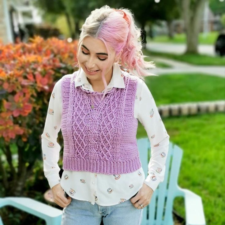 The Alice cabled crochet vest pattern is a cold-weather staple! It features a lovely cable pattern in the middle. Using the diamond stitch and a swirling cable, this vest has some unique old-school textures. Great for avid beginners, plus it comes with tips on sizing! Available in XS-5XL.