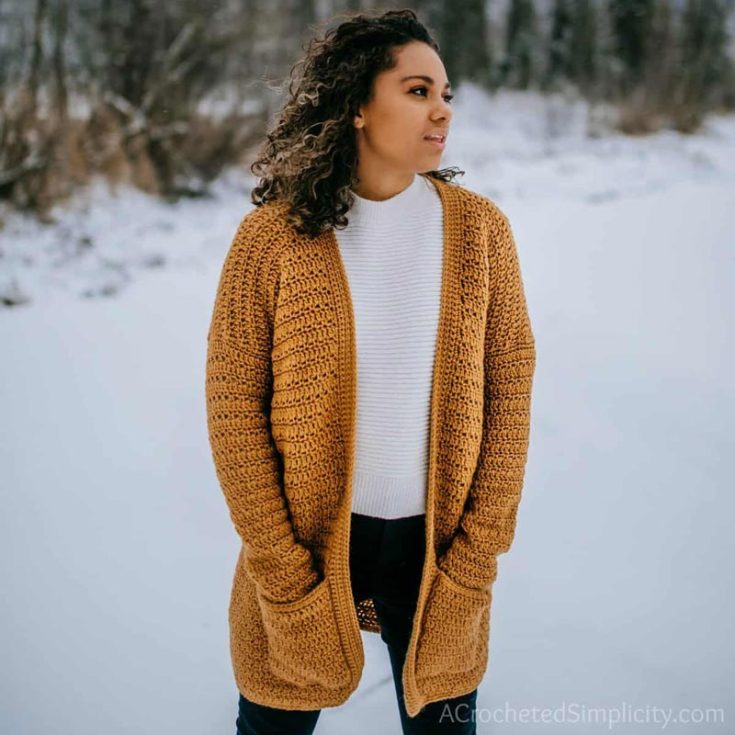 This crochet cardigan is a beautiful seasonal transition piece that can be worn during Winter for any occasion. The pattern offers sizes S-5X, and the chart in the article provides the sizing information that you need.