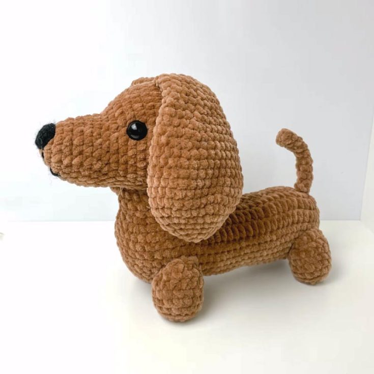 Say hello to your new stuffed toy companion, the Dachshund, otherwise known as the Wiener dog! This little baby is an intermediate-level design, so if you're up for a challenge, then step right up! This Dashy Dog is 14" long, and the tutorial is split into three parts. Click the links below for the neck, body, legs, tail, and assembly tutorials.&nbsp; Part 2 Tutorial (Neck and&nbsp;body) Part 3 Tutorial (Legs, tail, and assembly)&nbsp;