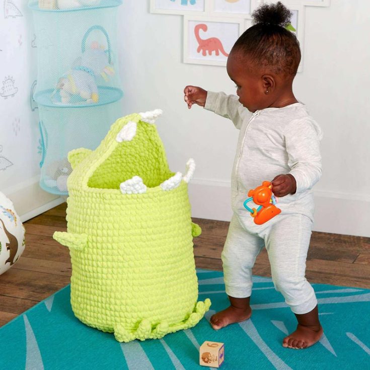 This crochet dinosaur toy basket adds functional fun to the children's nursery. It keeps the nursery neat while adding a touch of character. This basket is approx 11" in diameter x 20" tall and is worked from the bottom up.