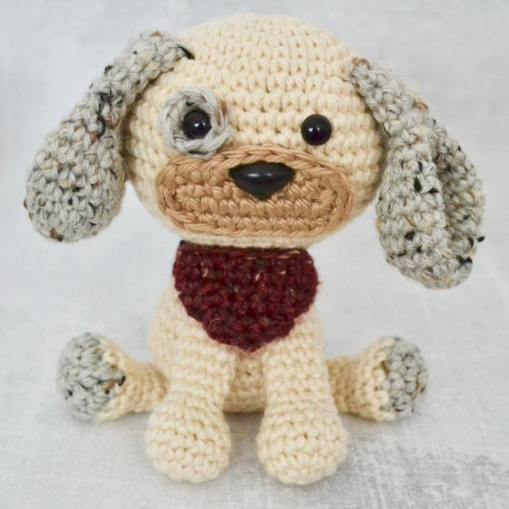 Dash, the dog, stands only 5" tall and is crocheted in continuous spirals without joining the rounds. He has a little eye spot and sits on the ground with his front paws in front of him, making him an excellent mantlepiece design! So cute! He is a beginner pattern, as there are very detailed steps to guide you through the whole process.