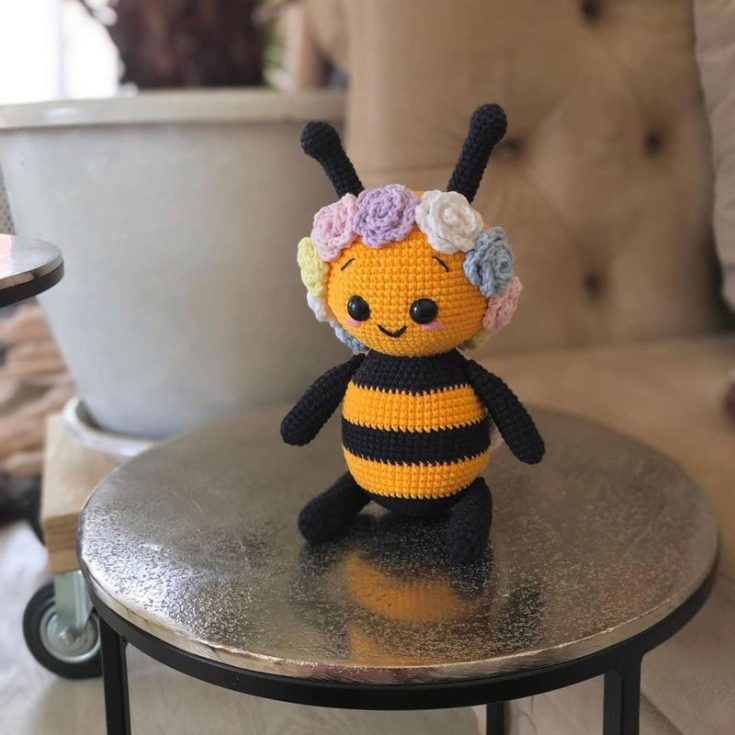 Check out this cute amigurumi bee with a flower wreath on its head. It only uses some basic stitches, like the slip stitch, single crochet, double crochet, and half double crochet stitches. The finished size is 8.6&rdquo;.&nbsp;