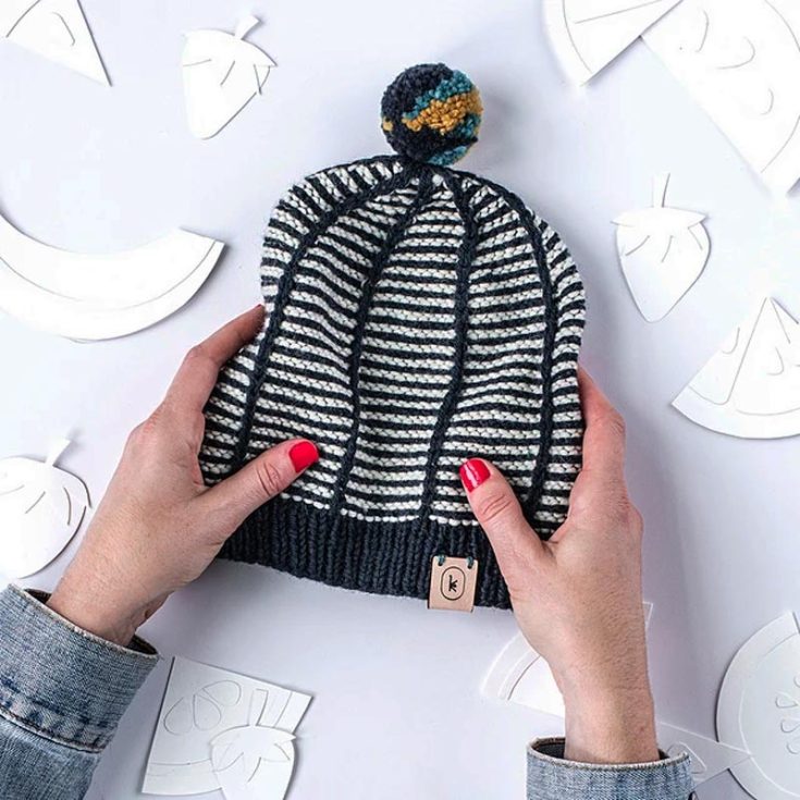 Try this super cute and straightforward knit beanie design for the holiday season! Doesn&rsquo;t it remind you of mimes? Whether you&rsquo;re looking to knit this for yourself or as a gift to your loved ones, this hat design promises a cozy sense of accomplishment with every row. The finished circumference is 16&rdquo; x 8.25&rdquo;.