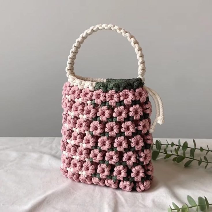This has to be our favorite design on the list! Don&rsquo;t you just love how gorgeous this handmade macrame bag is? Though it may look challenging, it&rsquo;s a beginner-friendly pattern! Since it&rsquo;s a big project, familiarise yourself with the basic knots in macrame and be patient with this piece, as it will take time to complete.