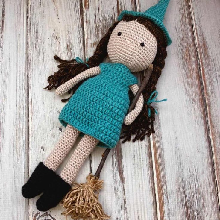 This crochet doll has a witch's hat, boots, and broom to complete her outfit.&nbsp;She has that minimalist aesthetic of simple features that will be precious to some! She is also 12" tall without the hat.