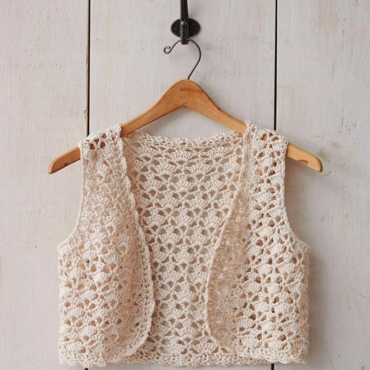 Feel the summer breeze with this airy patons seashell crochet vest pattern. With instructions for sizes XS-5XL, anyone with an intermediate crochet skill level can make this lacy seashell pattern and layer it over any summer outfit.