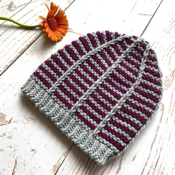 This beautifully made Peggotty pattern looks like a spider&rsquo;s web from the top view. It&rsquo;s a delight to make and promises warmth and style, 2-in-1. It&rsquo;s a fast project for beginners, as it only uses simple stitches and two-color bulky yarns. The finished size fits a head circumference of 16-18 (19-21, 22-24)&rdquo;.