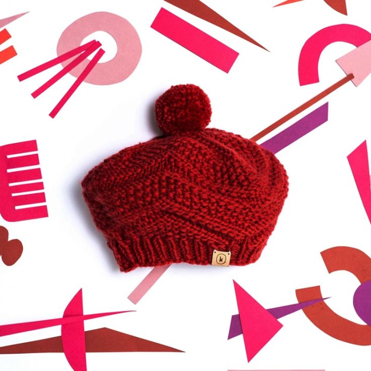 Here&rsquo;s another beret pattern that might interest you. This intricate design fits advanced knitters, made using the seed stitch, stockinette, and reverse stockinette chevron pattern. Whether you are planning a vacation in France or visiting your local coffee shop, this design will not disappoint. The finished size is 20.25&rdquo; x 9.5&rdquo;.