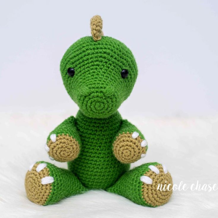 Toby, the Tobasaurus, is very similar to the Tyrannosaurus Rex. This design is suitable for advanced beginners and only uses three crochet stitches: the single crochet, slip stitch, and single crochet two stitches together. The finished size is 10" tall sitting and 12" tall standing.
