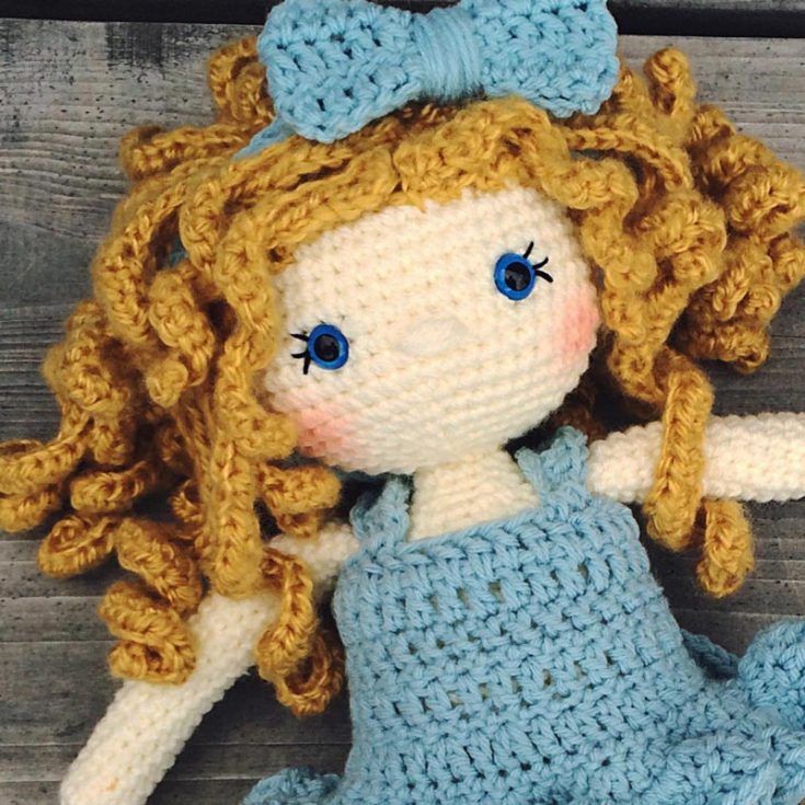 Grace, the doll, is graceful inside and out, like her name! She has a head of gorgeous ginger locks, a ruffled tutu, and some crisscross shoes. We are absolutely in love with her, and we can't wait to get started on her design. She is about 15" tall and 3" wide.