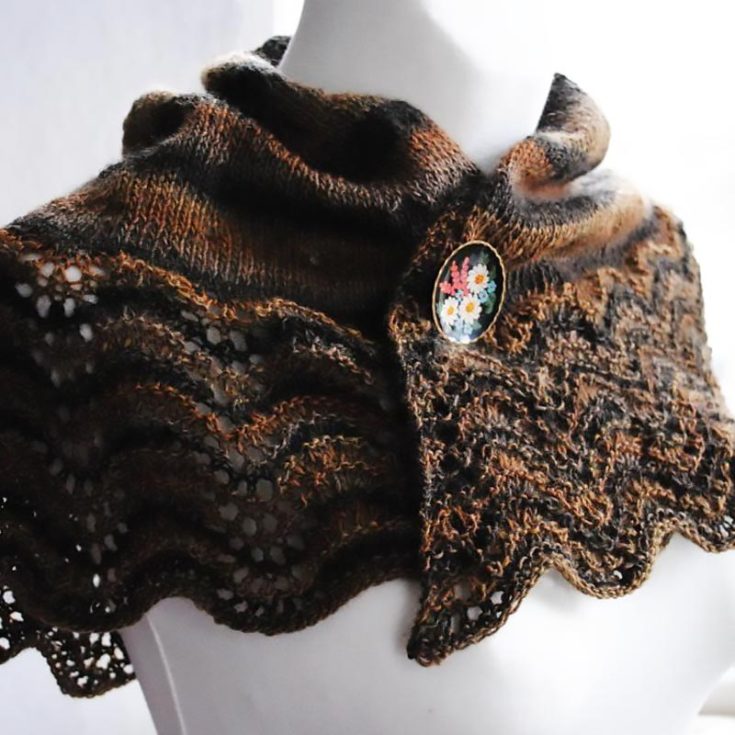 This dark-academia-themed shawlette uses the simple knit, purl, make 1, knit 2 together, and yarn overs technique to accomplish this delightful design! It also features a feather and fan edging, and this knit project is excellent for avid beginners. Did we mention that you&rsquo;ll look super stylish throughout the season? Just follow the easy instructions in the PDF to recreate this beauty.