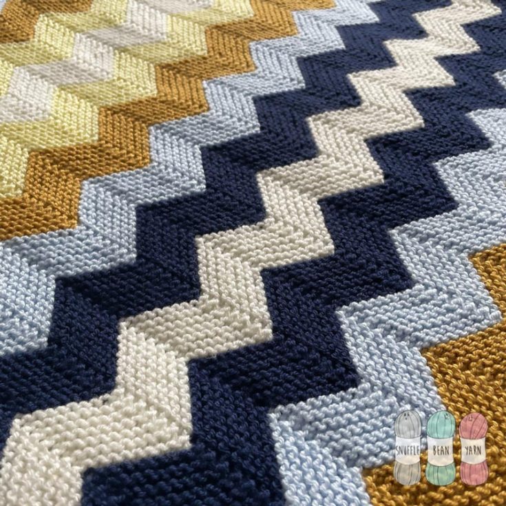 Check out this charming color-blocked Chevron Blanket pattern that allows you to knit quickly by following this detailed instructions guide with a video tutorial as well! It&rsquo;s a great blanket design for beginners to try out something different, and it incorporates basic knit stitches such as the garter stitch. It&rsquo;s such a visually striking blanket, using bright, modern colors to make it stand out. The finished size is 60cm x 80cm.